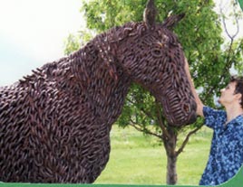 Horse statue made of chain, Gabe petting
